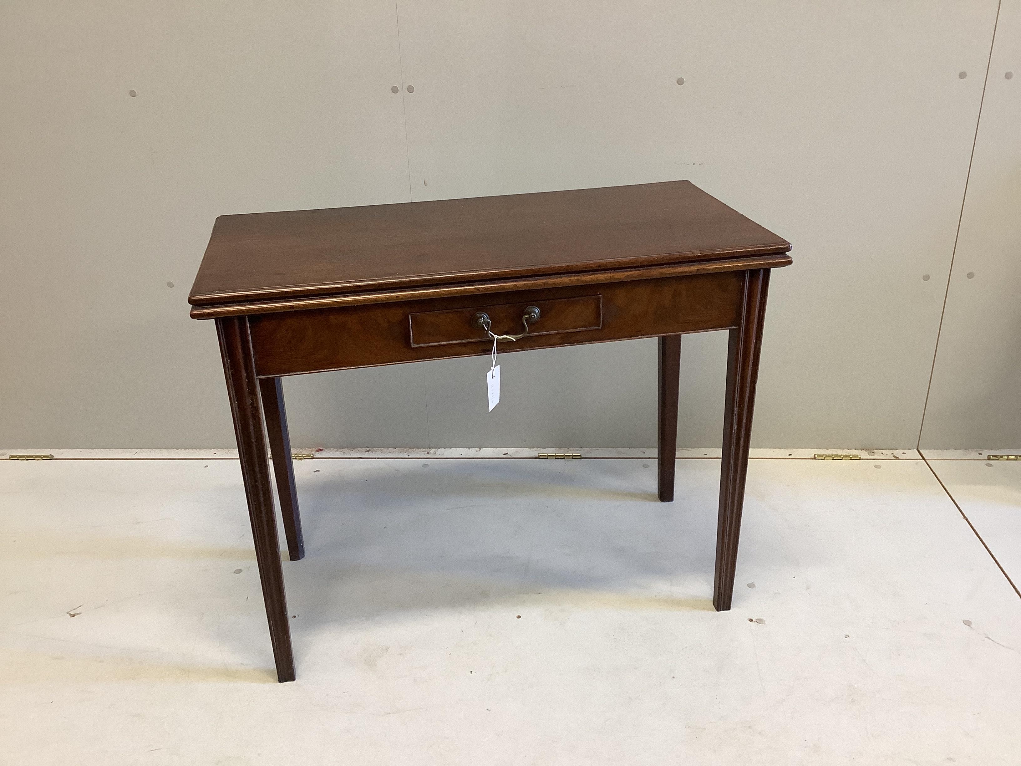 A George III rectangular mahogany folding tea table, width 92cm, depth 45cm, height 73cm